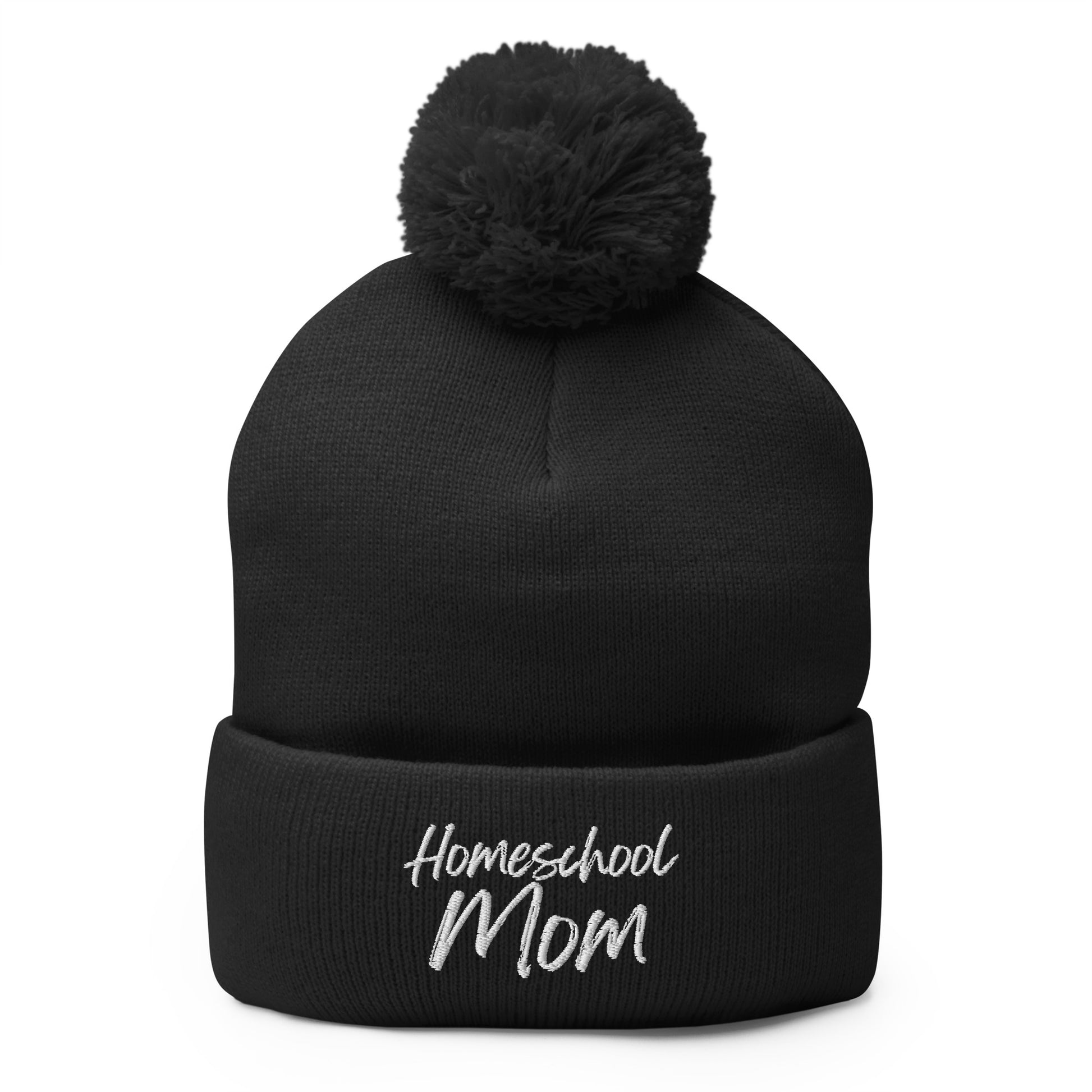 Homeschool Mom embroidered pom-pom beanie in classic knit style — cozy Christian winter hat by Morning Flora Devotionals.